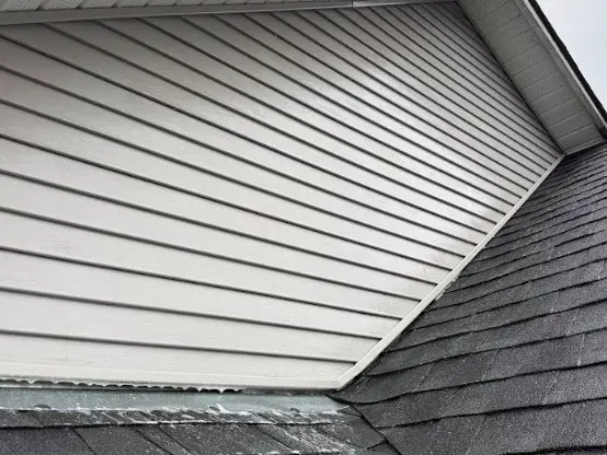 The same siding and soffit clean after softwashing