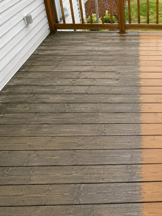 Grey, weathered wooden deck boards before washing