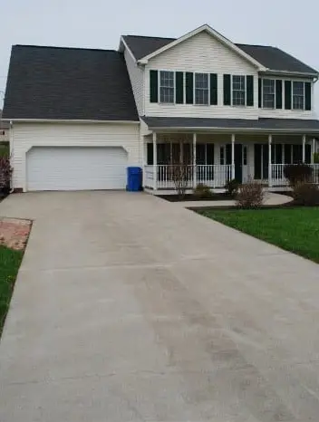 The same driveway light and clean after pressure washing